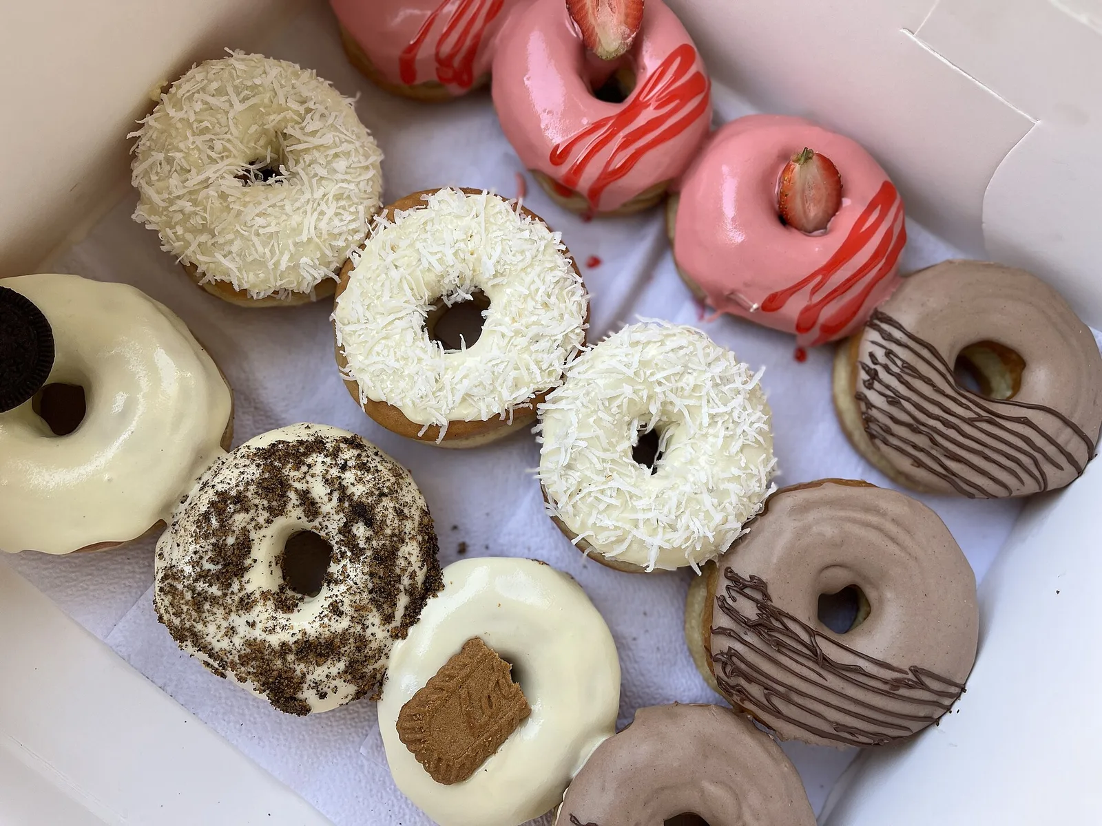 Glazed ring doughnuts on a tray.