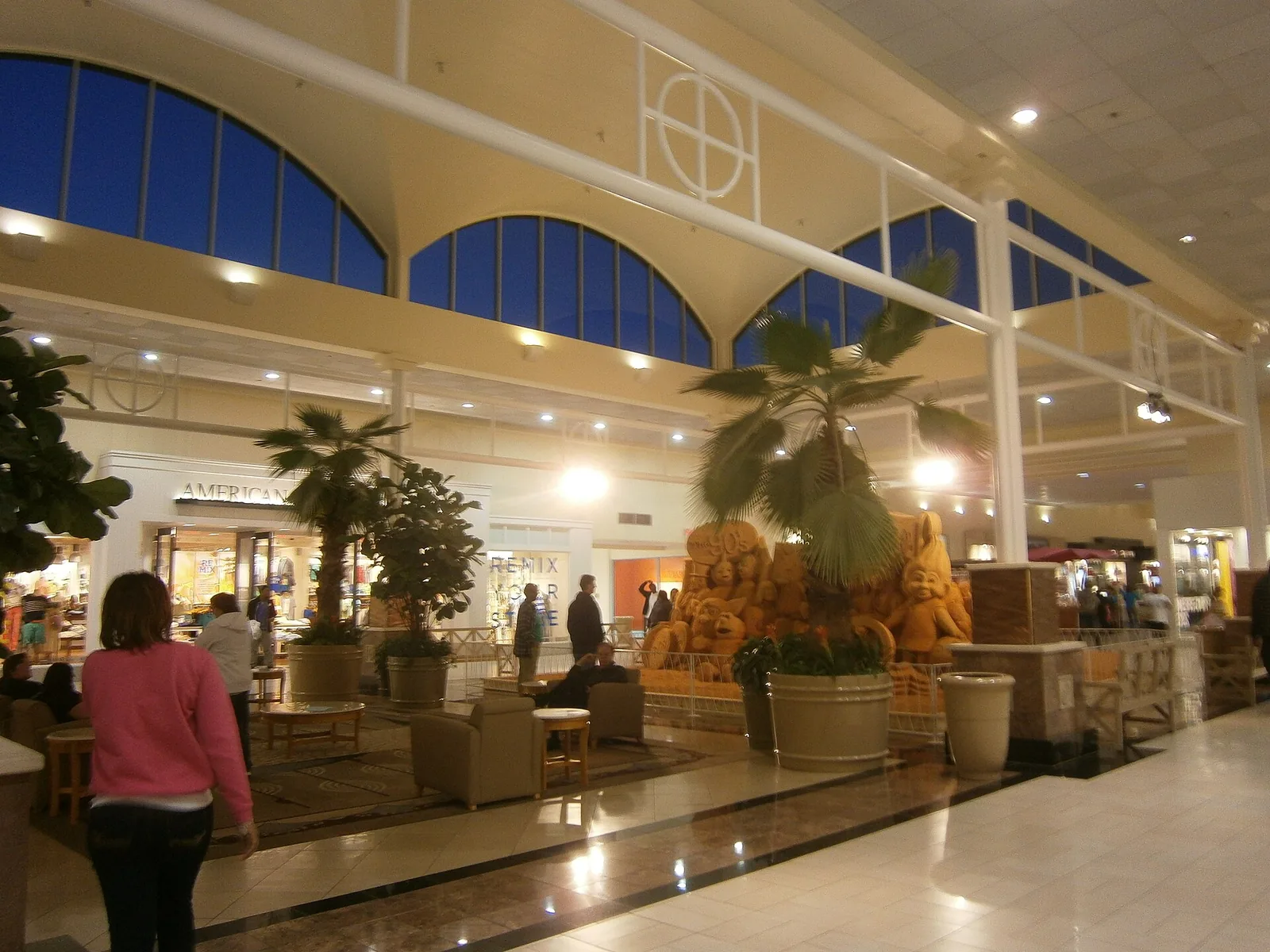 Shoppers walk past palms and a sand sculpture in the center court of Edgewater Mall on Beach Boulevard in Biloxi.