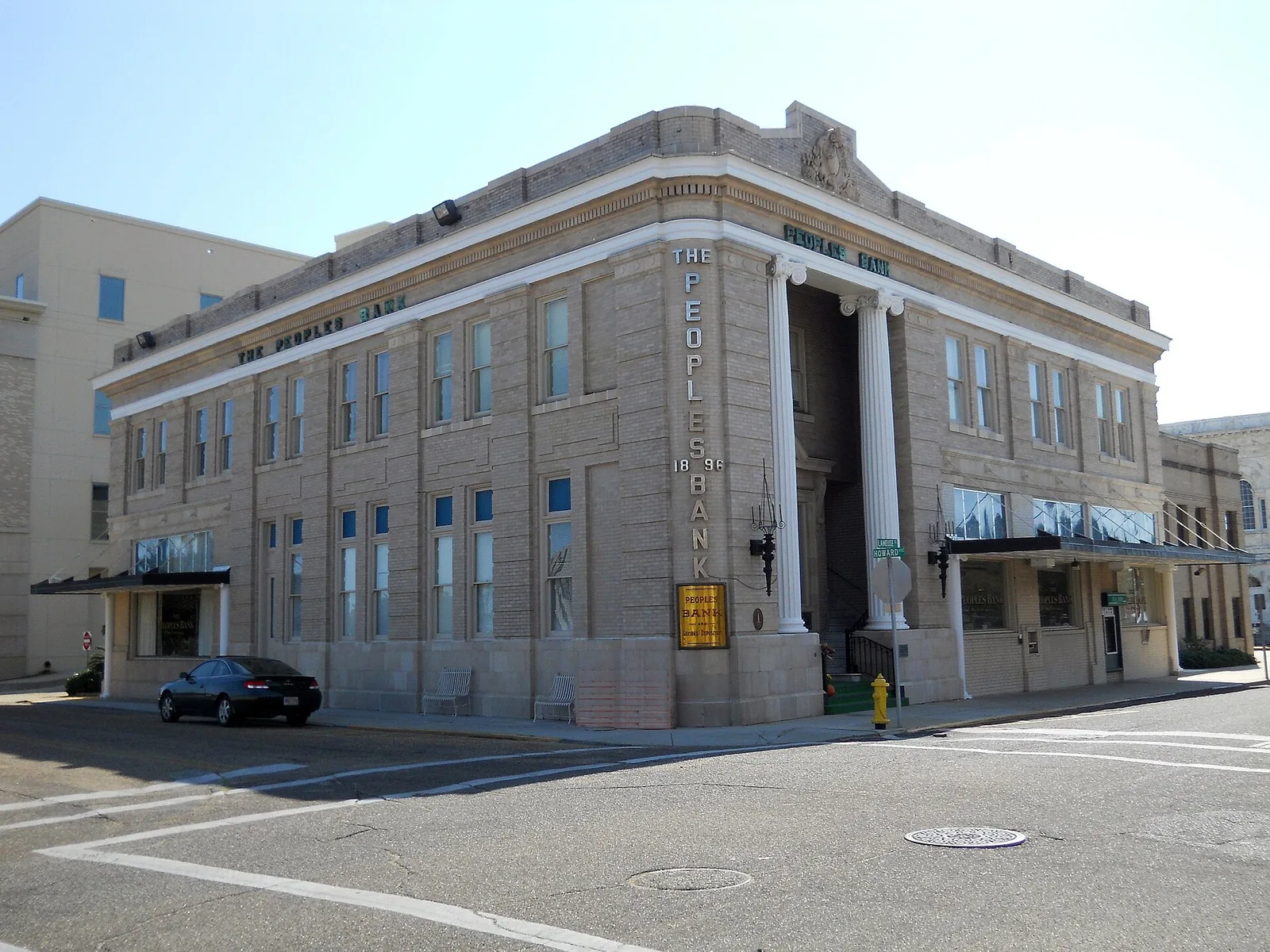 The Peoples Bank building at Howard Avenue and Lameuse Street, the downtown Biloxi corner where several brunch spots sit within a block or two.