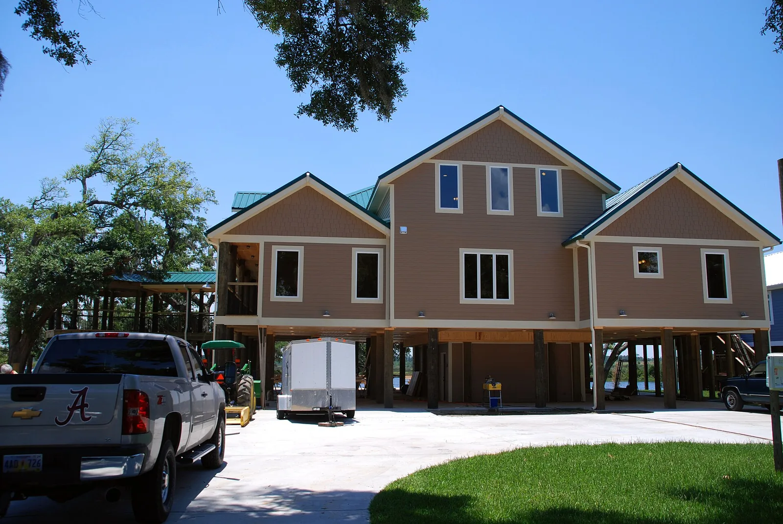 A new home in Biloxi nears completion, raised on pilings to meet flood elevation requirements.
