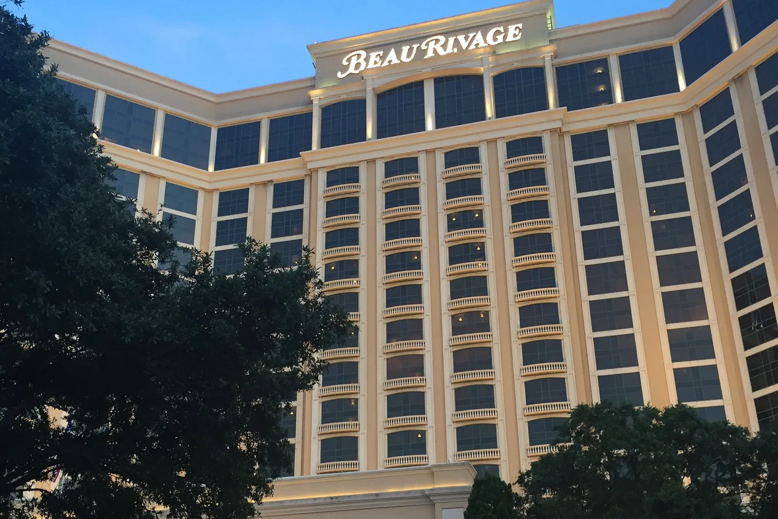 Beau Rivage Resort and Casino on Beach Boulevard in Biloxi, its entrance lit in the evening.