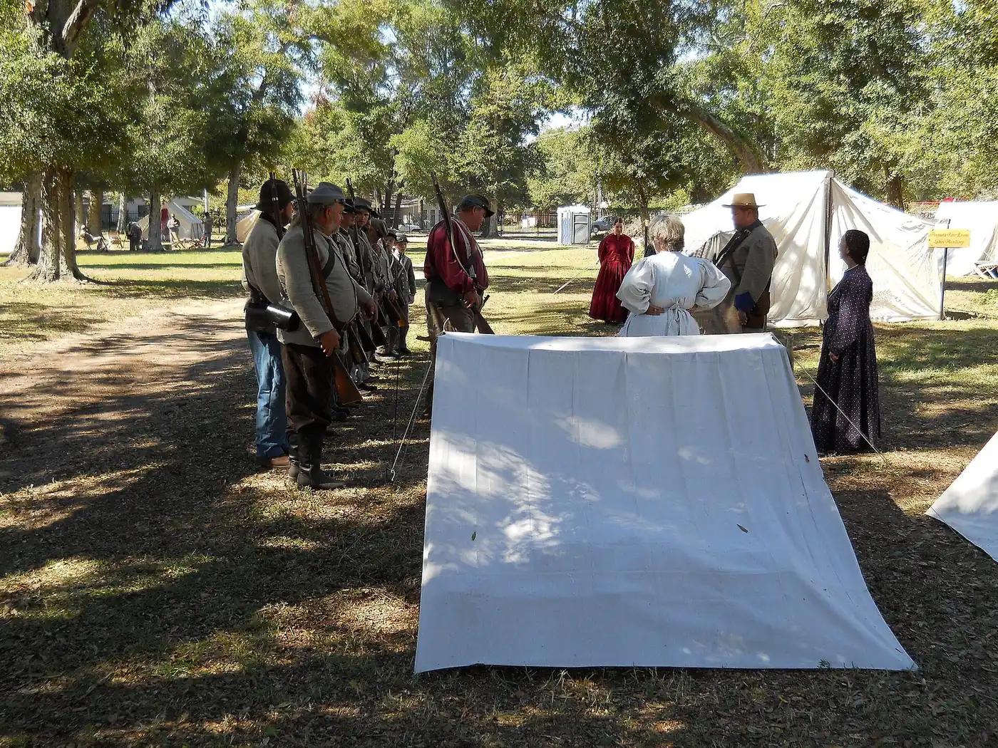 Living history reenactors drill among the tents on the Beauvoir grounds during the Fall Muster.