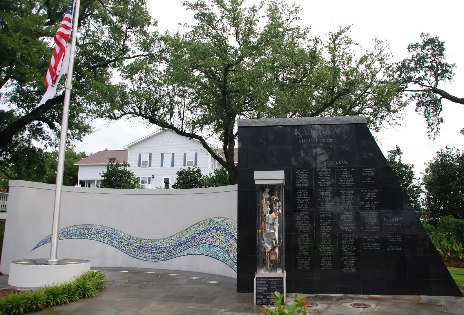 The Hurricane Katrina Memorial on the Biloxi Town Green; its black granite wall stands as high as the storm surge.