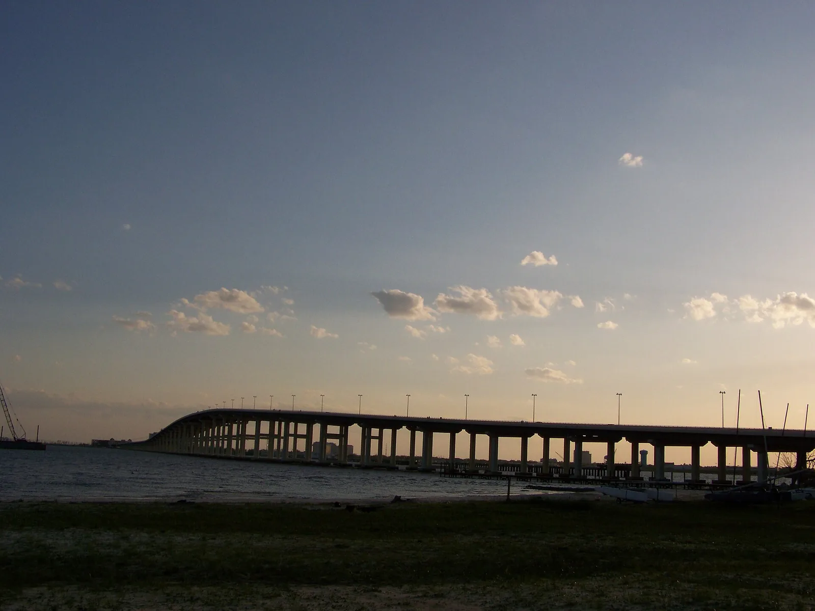 The Biloxi Bay Bridge at sunset, carrying U.S. 90 across Biloxi Bay toward Ocean Springs.