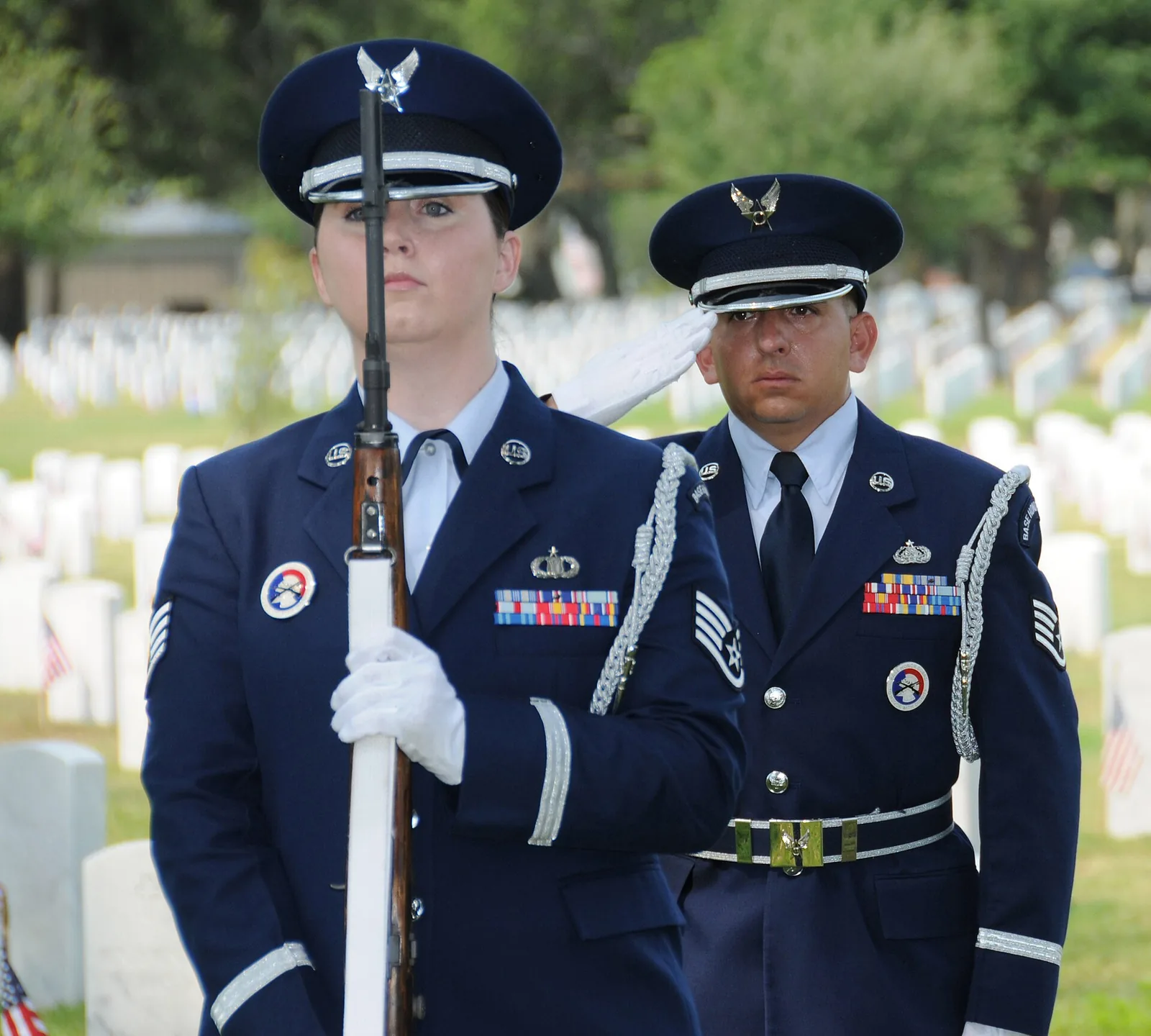 A Keesler Air Force Base honor guard stands among the headstones during a Memorial Day ceremony at Biloxi National Cemetery.