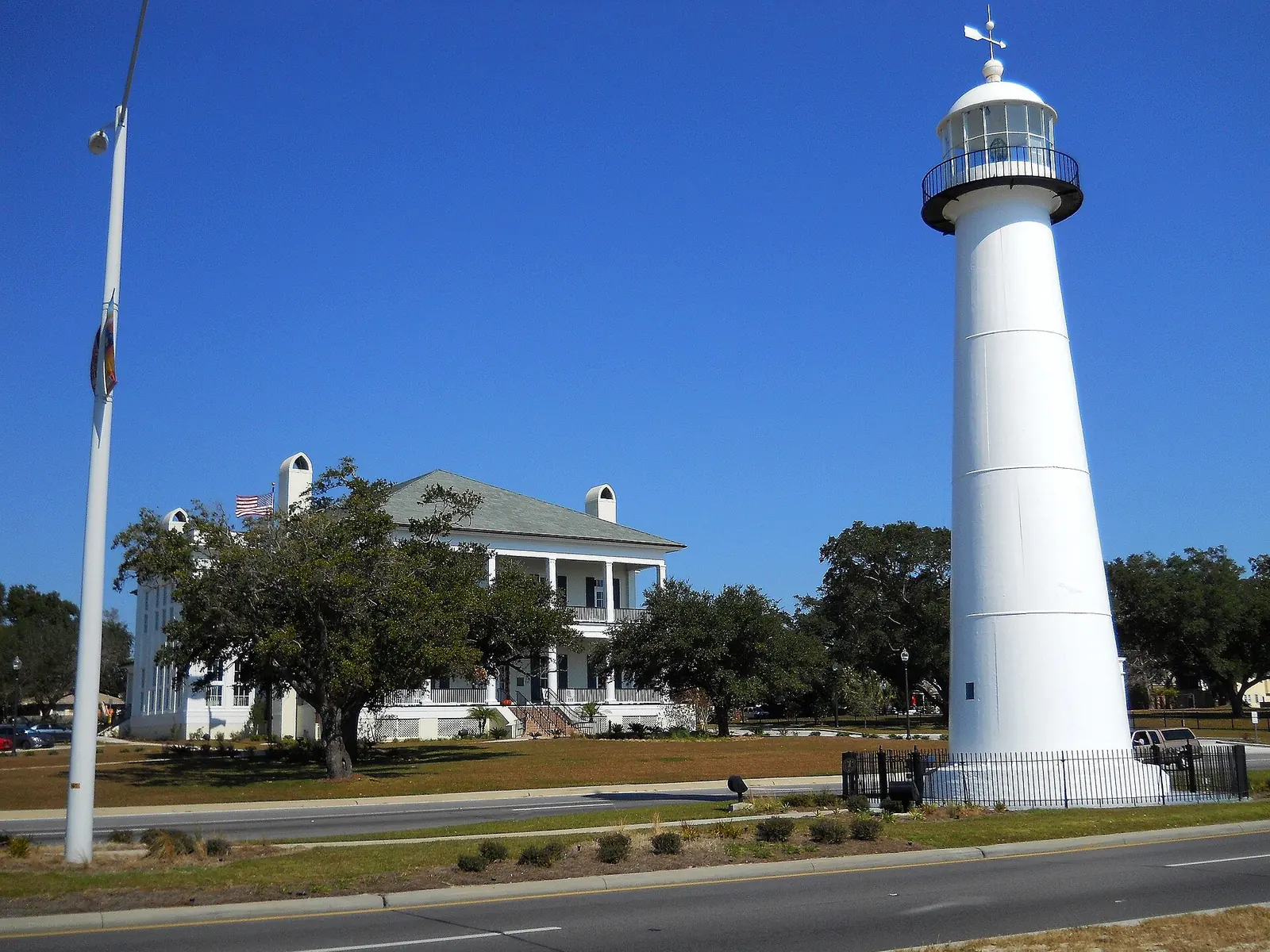 The Biloxi Lighthouse on U.S. 90, with the Biloxi Visitors Center behind it.