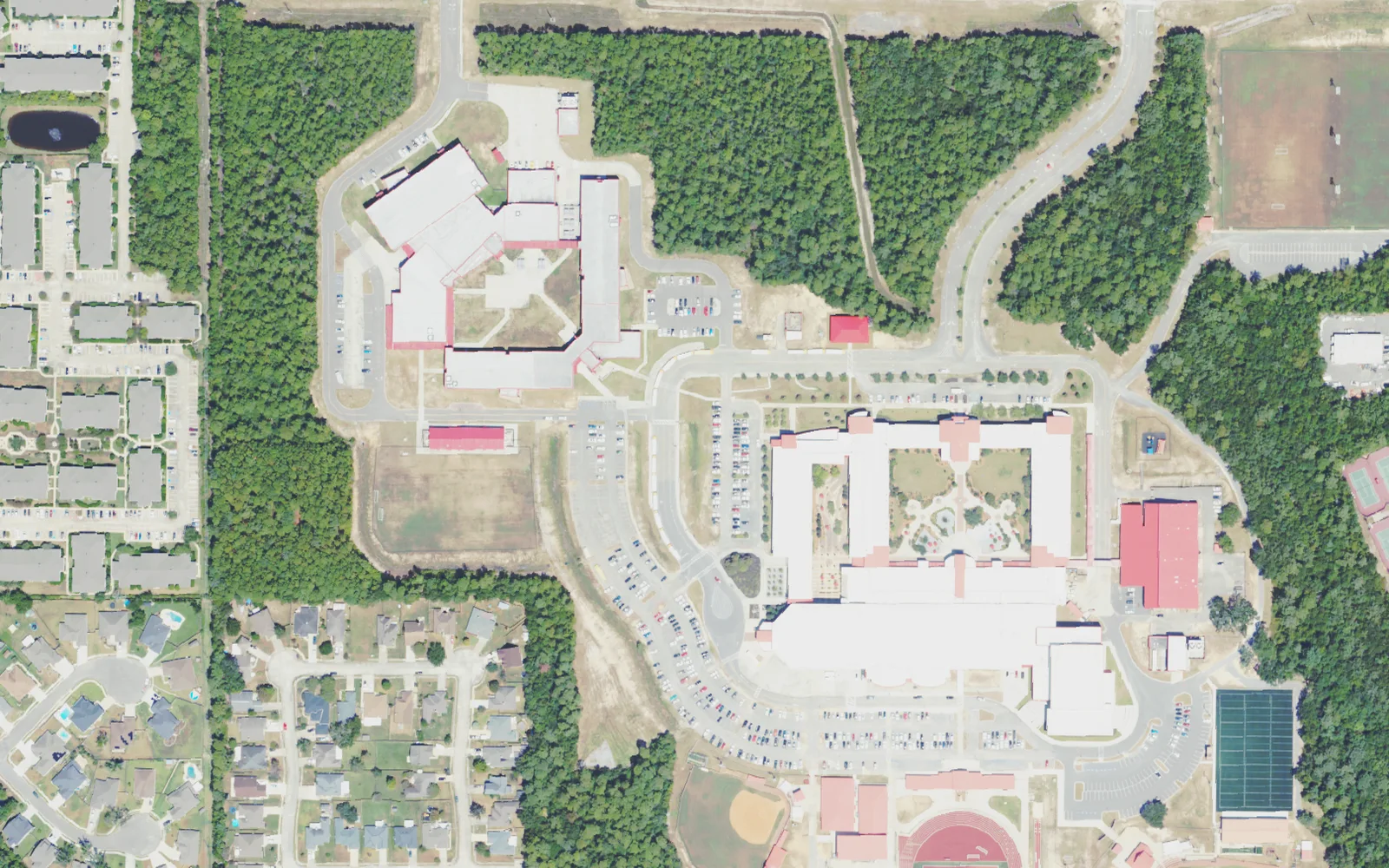 Biloxi Junior High School, top, and Biloxi High School, lower right, on neighboring campuses off Tribe Drive in north Biloxi, seen from the air.