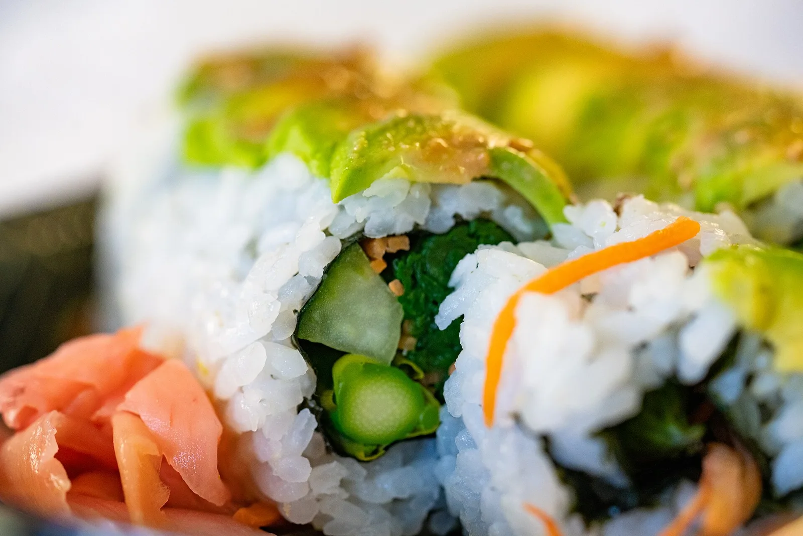 A plate of assorted sushi rolls.