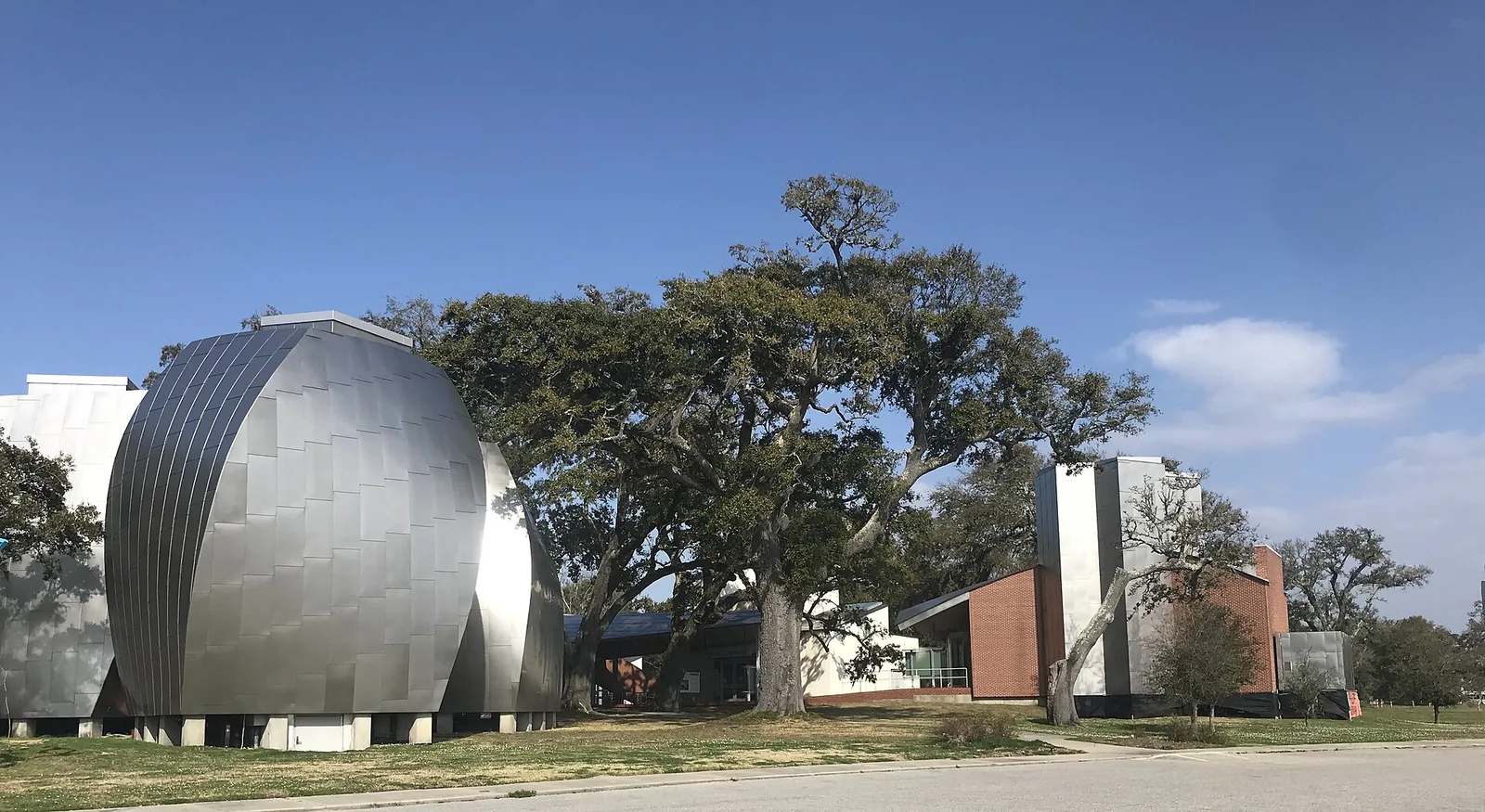 The steel-clad gallery pods and live oaks of the Ohr-O'Keefe Museum of Art on Beach Boulevard in Biloxi.